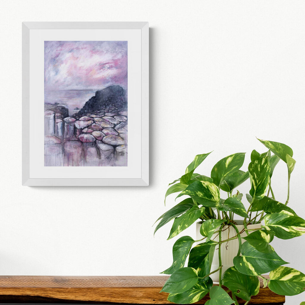 Pink Causeway giclee print of the Giant's Causeway by Frankie Creith hanging on a wall.