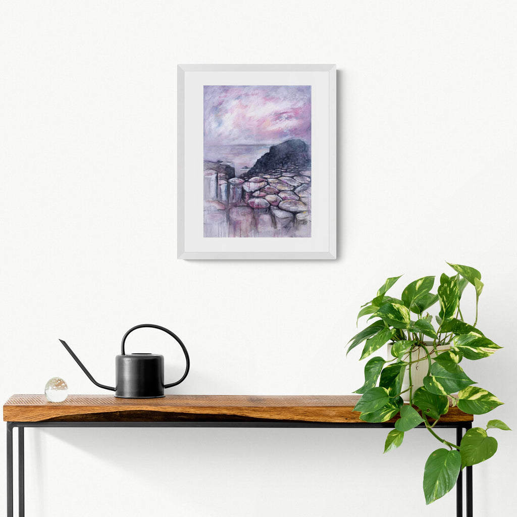 Pink Causeway giclee print of the Giant's Causeway by Frankie Creith hanging in a wall.